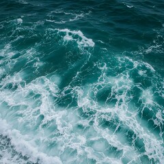 Fototapeta premium Stunning aerial view of vibrant turquoise ocean waves with white foamy surf detail