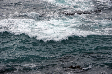 Ocean surf waves at the central California coast in winter