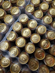 Beer cans. Aluminum beer cans in supermarket. Beer products on shop shelves