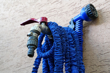 Water tap outside the building. Outdoor tap for watering a garden plot