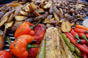 Various fried foods. Red peppers, potatoes, zucchini, champignon mushrooms