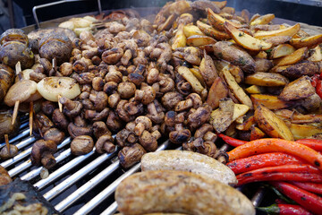 Fried hot foods. Hot peppers, zucchini, potatoes, onion, sausages and mushrooms