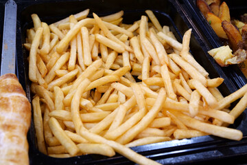 French fries. Fried potatoes. Street fast food restaurant