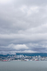 Fototapeta premium North Vancouver Clouds and Mountains.North Vancouver across Burrard Inlet. Coast Mountains and clouds in the background. 