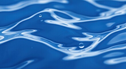 Close-up of undulating blue liquid surface with bubbles, soft lighting