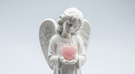 Obraz premium White Angel Figurine Holding Pink Rose Quartz Heart