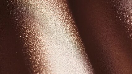 Close up detailed texture of shimmering metallic rose gold fabric with subtle wave pattern and soft studio lighting - Powered by Adobe