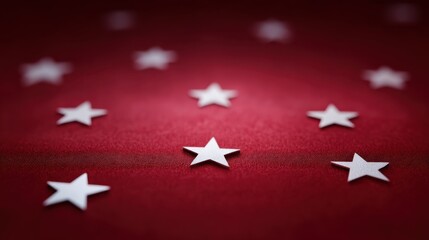White stars scattered on a rich red background creating a festive and patriotic theme ideal for celebrations, holidays, or national events and occasions.