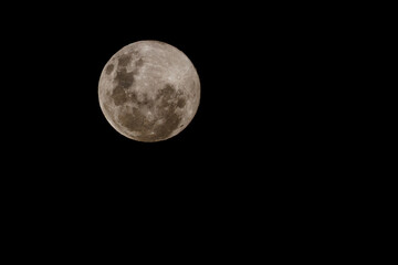 Detailed full moon on black background