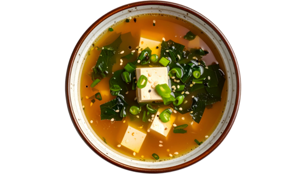 Overhead view of miso soup with tofu, seaweed, and scallions