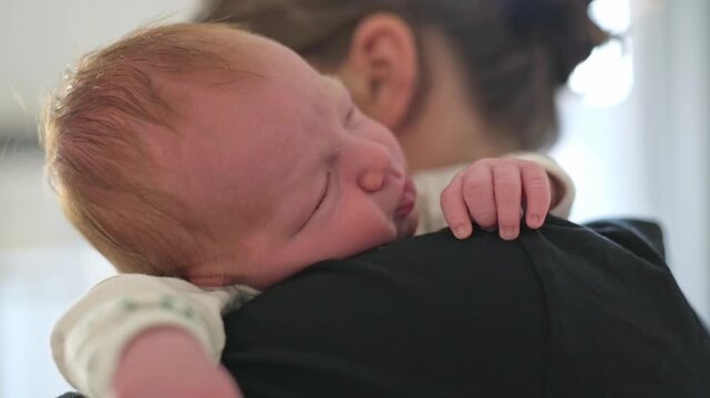 baby with guardian, infant supervised and cared for by adult, young child being looked after by responsible adult figure, baby under attentive supervision of designated caregiver or guardian