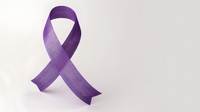 Purple awareness ribbon placed on clean white background symbolizing pancreatic cancer support in minimal close-up detail. Health concept