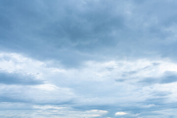 Overcast sky filled with layers of moody blue and white stratocumulus clouds