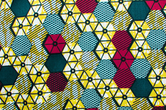 top view of green ankara fabric, flatlay of nigerian wax cloth with designs, spread out green ankara material