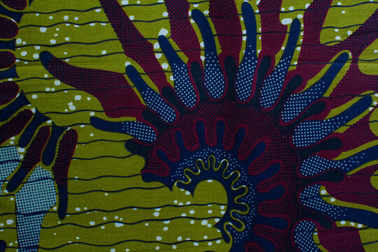 top view of green ankara fabric, flatlay of nigerian wax cloth with designs, spread out green ankara material