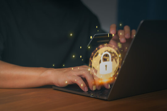 Person using laptop with a digital padlock symbol, representing secure online payment, data protection, cybersecurity, encrypted transactions, and safe financial operations in the digital world.