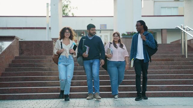 Diverse group of university students walking downstairs
