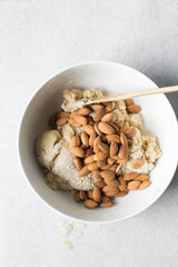 overhead view of almond biscotti dough being mixed in a white bowl, flatlay of biscotti cookie dough or twice baked cookie dough