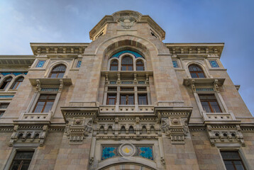 Fototapeta premium Magnificent facade of the historic Buyuk Postane PTT Post Office, ornate Ottoman style with intricate arches and mosaic tile work in Istanbul, Turkey