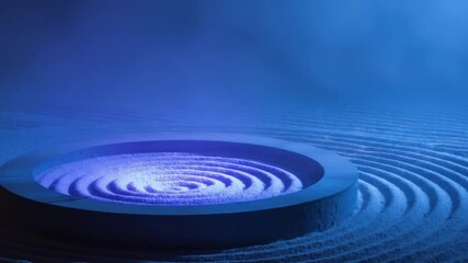A zen garden with a circular element filled with sand and concentric pattern, under blue light - Powered by Adobe