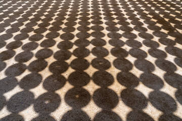 lantern shadows on the ground in a Buddhist temple