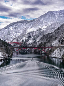 Tour Boat Creating Ripples in the Snowy Sho River Gorge, Nanto City Toyama