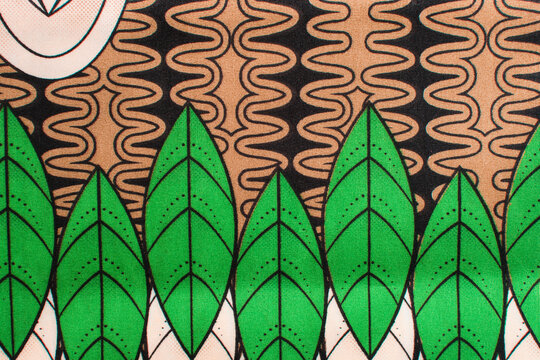 top view of green ankara fabric, flatlay of nigerian wax cloth with designs, spread out green ankara material