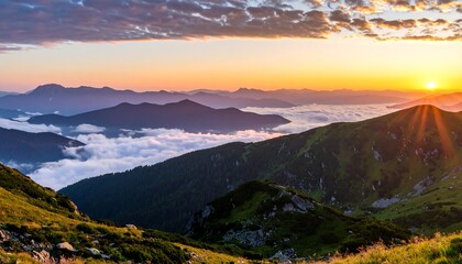 A breathtaking landscape captures the sunrise over a mountain range with layers of peaks. The sun's rays burst through the sky