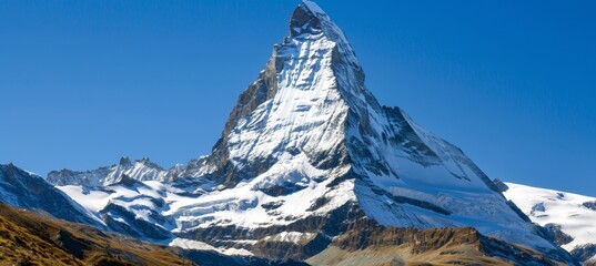 Adventure awaits  snowy mountain peak under a clear blue sky for winter sports enthusiasts