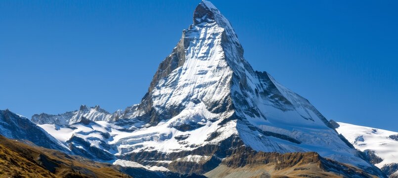 Adventure awaits  snowy mountain peak under a clear blue sky for winter sports enthusiasts