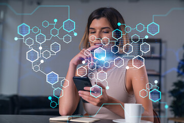 Smiling businesswoman in casual wear holding using smartphone typing at office workplace with notebook. Concept of distant work, business education. Blockchain crypto hologram