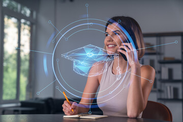 Smiling businesswoman in casual wear holding using smartphone typing at office workplace with notebook. Concept of distant work, business education. Math icons hologram