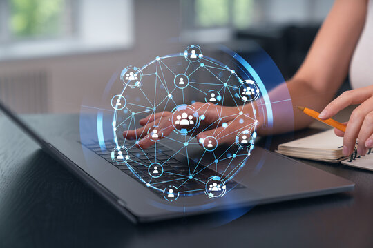 Woman typing on laptop at office workplace in background. Concept of working process, internet surfing, online business education. Student send e-mail. Close up view. Social network icons