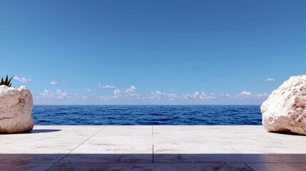 A serene coastal scene featuring a wide expanse of blue ocean meeting a clear sky, with two large rocks and a tiled patio in the foreground.