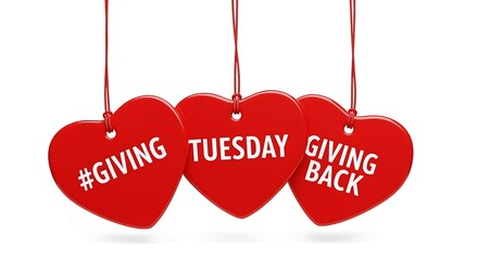 Red heart ornaments with Giving Tuesday text hanging on white background string