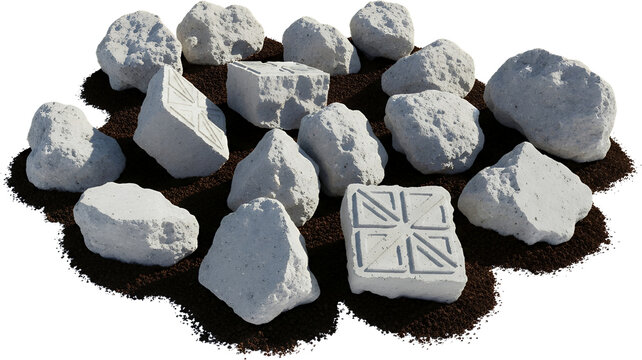 A pile of rough textured grey stones and two cubic concrete blocks with geometric patterns sit on dark soil rock material