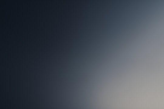 Soft abstract gradient blending pale navy and gray tones creating a calm elegant minimalist background with subtle depth