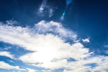 Peaceful Blue Sky with Fluffy White Clouds