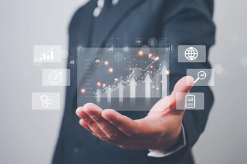 Businessman reviewing profit results and quality management, working with budgeting, cost planning, financial forecasts, and revenue analysis to improve long-term business performance.