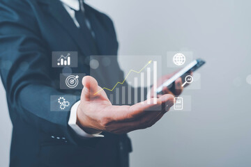 Businessman reviewing profit results and quality management, working with budgeting, cost planning, financial forecasts, and revenue analysis to improve long-term business performance.