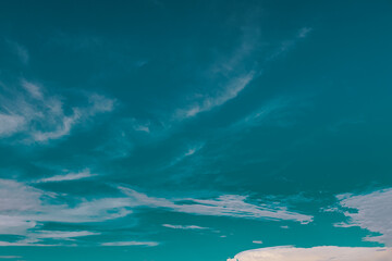 Peaceful Blue Sky with Fluffy White Clouds