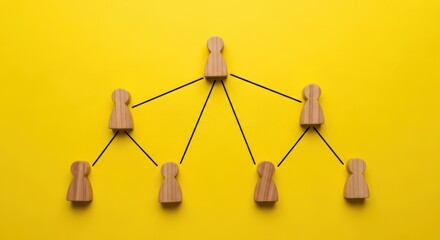 Wooden figures connected in a hierarchical organizational chart structure.
