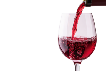 Red wine being poured into an empty glass from a bottle in closeup view against a transparent background for beverage concepts