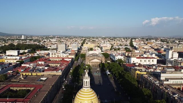 Sunset light illuminating the Cathedral Basilica of the Assumption of the Blessed Virgin Mary. Dolly out starting at the dome.