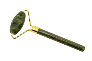 Green jade facial roller with golden accents on white background.