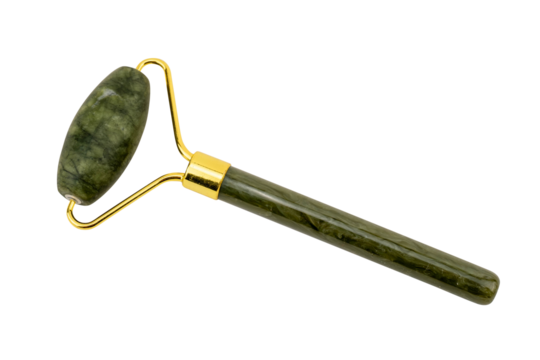 Green jade facial roller with golden accents on white background.
