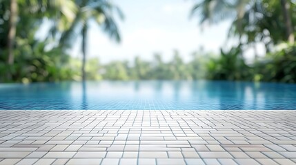Infinity pool with tiled deck and blurred tropical palm trees under a bright summer sky, copy space