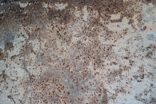 Close-up of heavily rusted and worn metal surface texture.