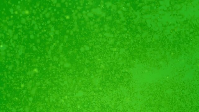 Fine Gold Dust Particles Swirling and Exploding on a Green Screen Background Chroma Key Overlay.