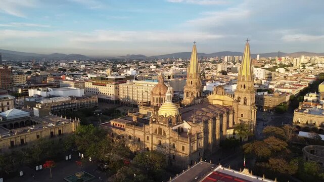 The light of dawn illuminates the cathedral's towers and domes. Guadalajara, Jalisco, M&eacute;xico